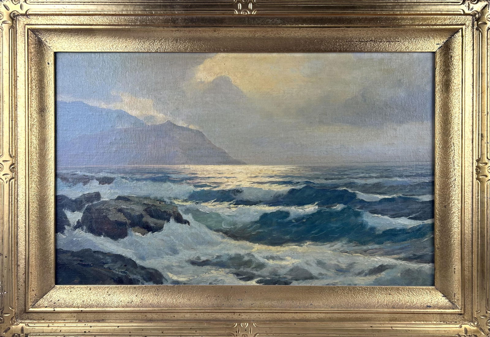 PAINTING OF A ROCKY COAST 20th Century Oil on masonite, 20" x 32". Framed 27" x 39".: PAINTING OF A ROCKY COAST20th CenturyUnsigned. Paper label on back marked "Dantonio".Oil on masonite, 20" x 32". Framed 27" x 39".