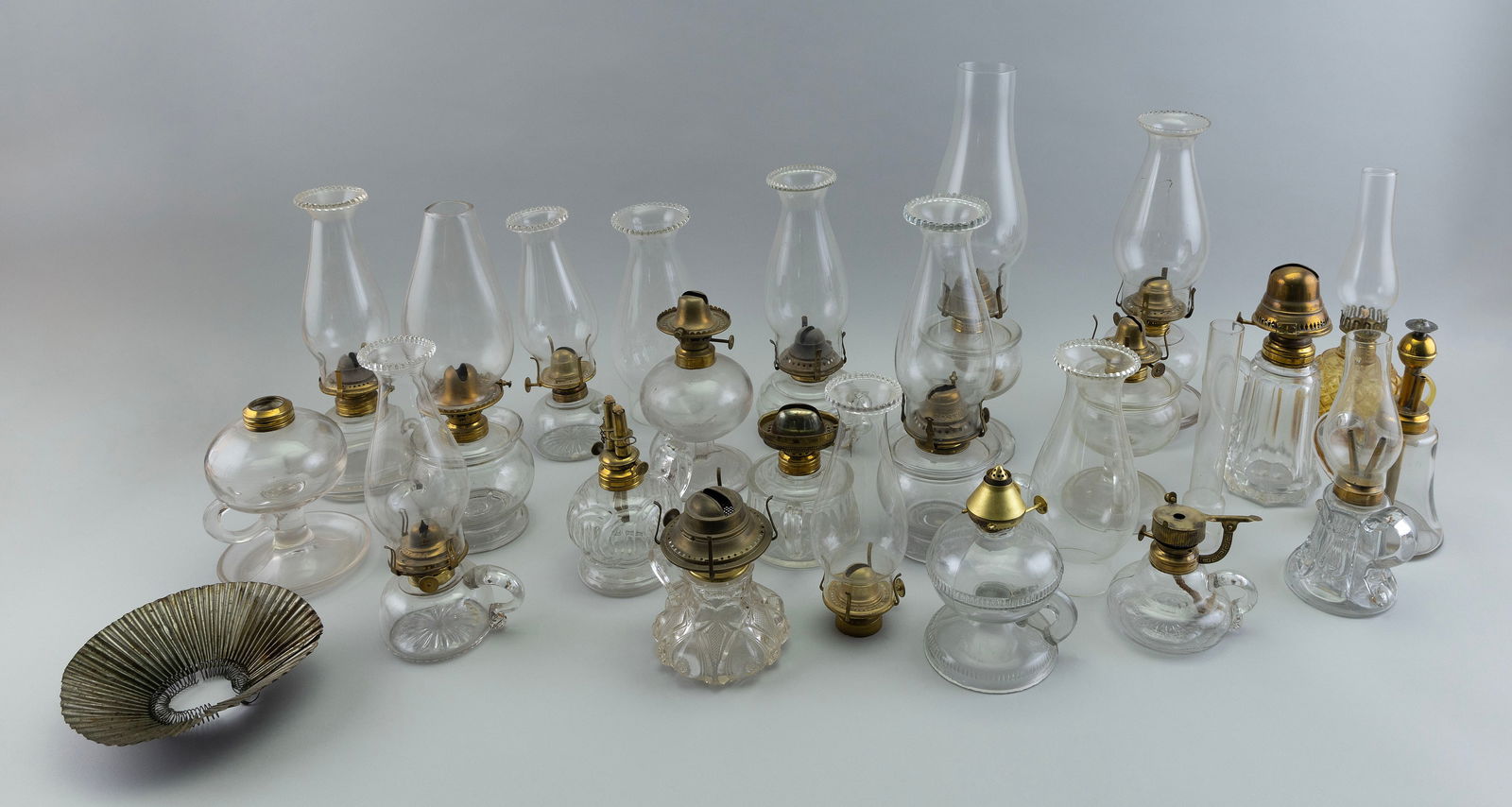 TWENTY GLASS HAND LAMPS 19th to Early 20th Century Heights to collar from 3" to 5.25". (1 of 1)