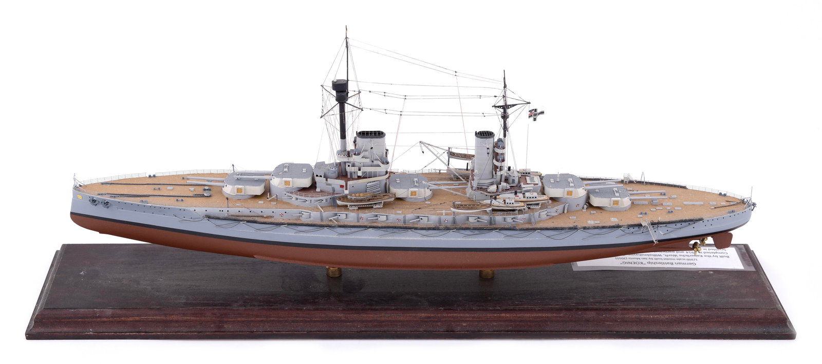 MODEL OF THE GERMAN BATTLESHIP "KOENIG" 21st Century Height approx. 8.75". Total length 21".: MODEL OF THE GERMAN BATTLESHIP "KOENIG" 21st Century Made by Jan Muntz. Displayed on brass pedestals on a wooden base. Height approx. 8.75". Total length 21".