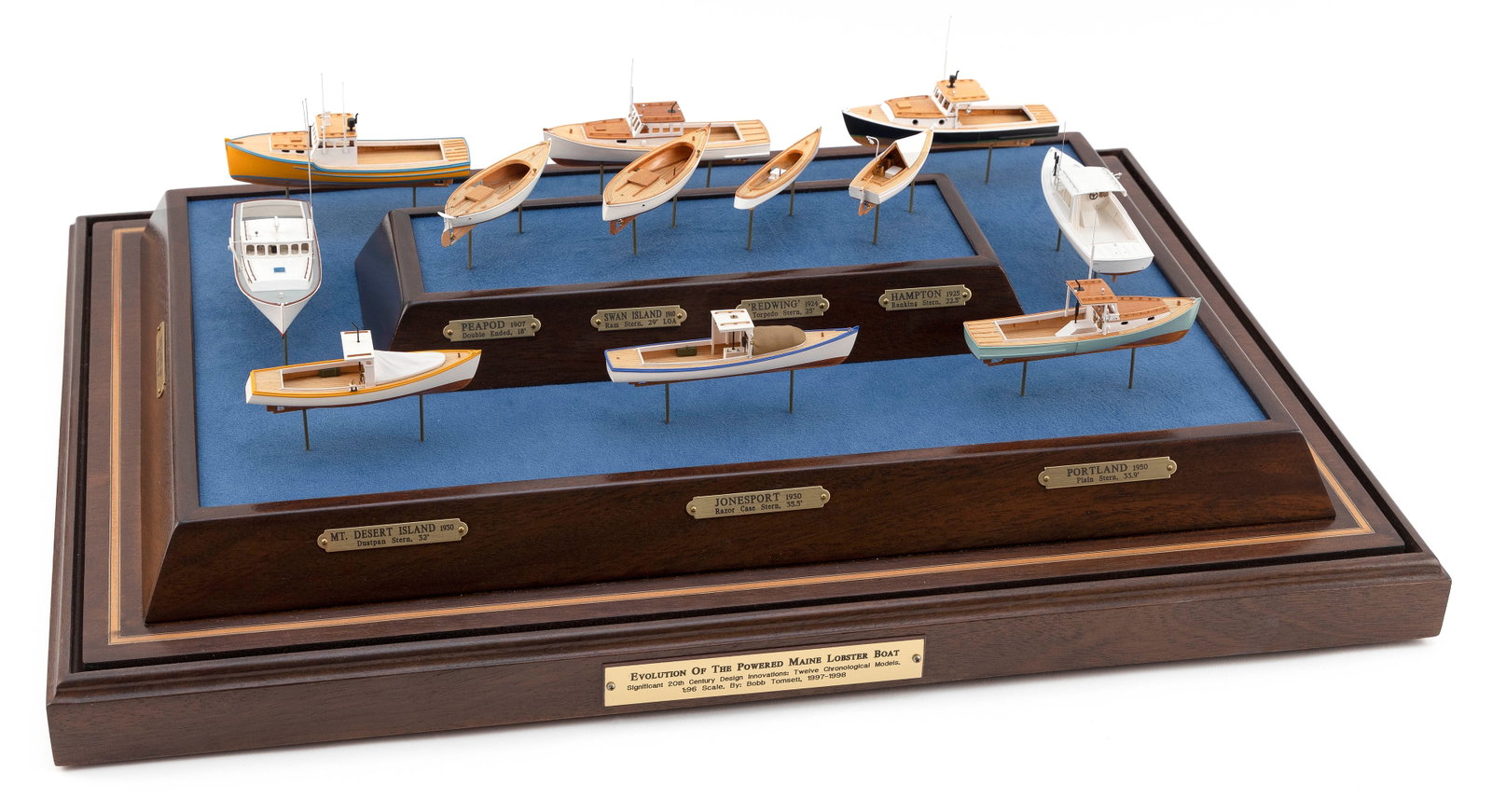 COLLECTION OF MINIATURE MOTORIZED MODELS DEPICTING THE EVOLUTION OF THE POWERED MAINE LOBSTER BOAT: COLLECTION OF MINIATURE MOTORIZED MODELS DEPICTING THE EVOLUTION OF THE POWERED MAINE LOBSTER BOAT 20th Century By Bob Tomsett (England, 1952-). Includes twelve scratch-built models in 1/96 scale with