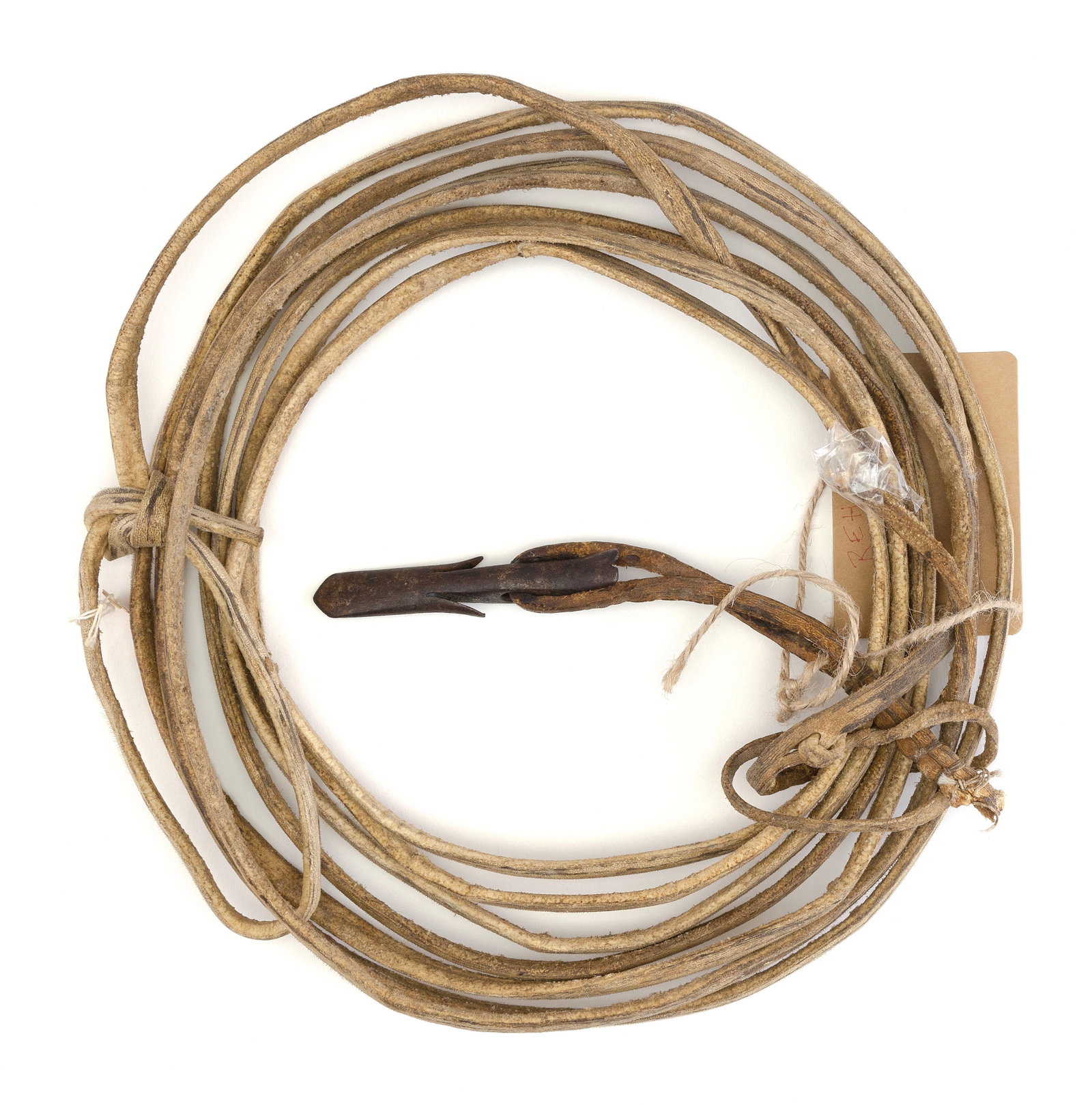 INUIT HARPOON HEAD WITH SINEW Early 20th Century Harpoon head length 4".: INUIT HARPOON HEAD WITH SINEW Early 20th Century Harpoon head length 4". Additional information about this lot may be found on the Hellman Collection website, number REH349. Provenance: The Collection