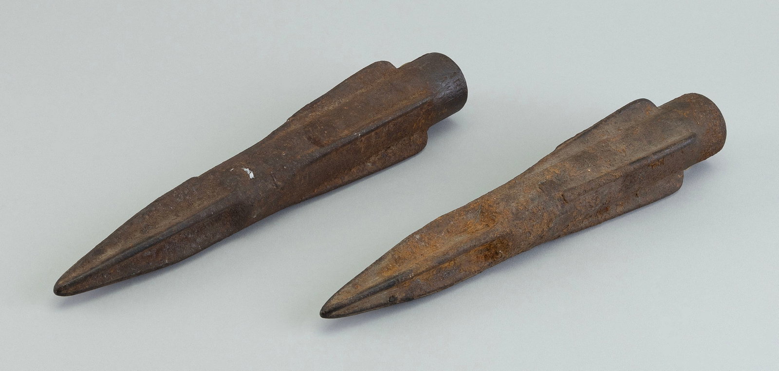 TWO CAST IRON TIPS FOR HARPOON BOMBS Late 19th/Early 20th Century Lengths 10.25".: TWO CAST IRON TIPS FOR HARPOON BOMBS Late 19th/Early 20th Century Lengths 10.25". Provenance: The Collection of Bob and Nina Hellman, Nantucket, Massachusetts.