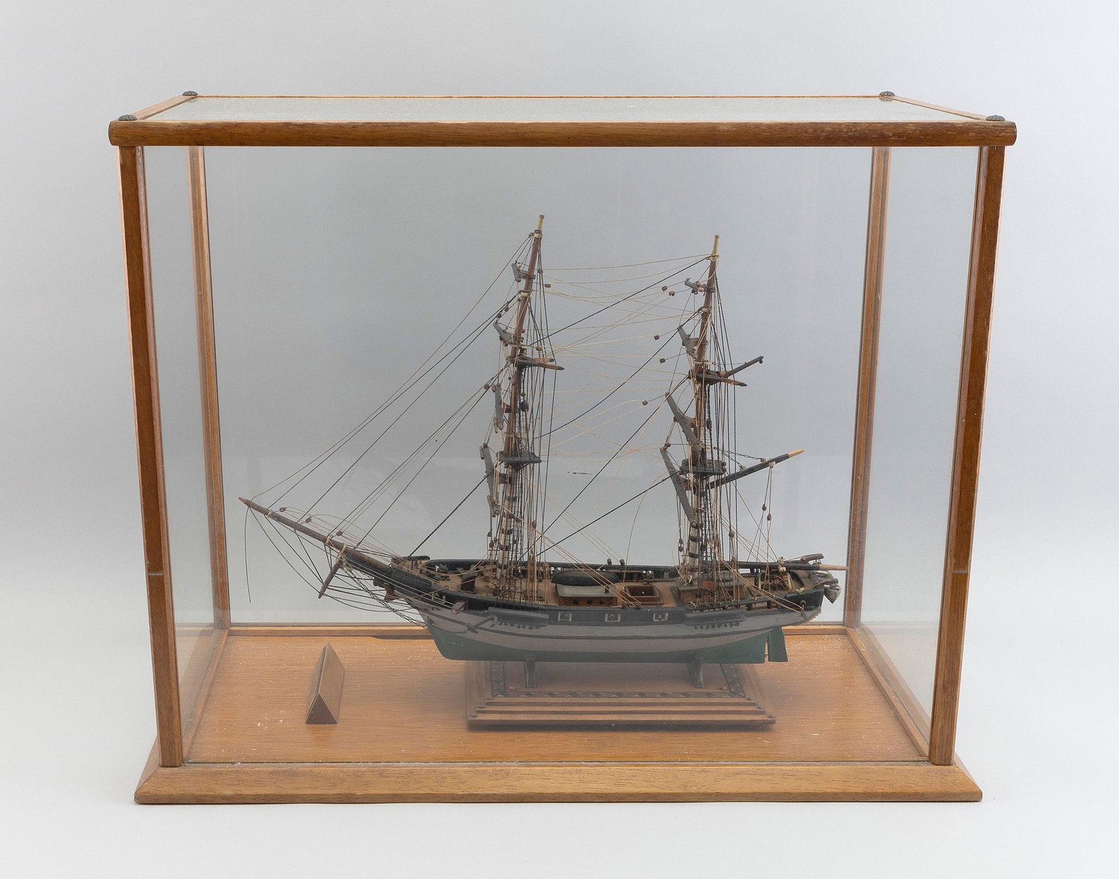 CASED SAILOR-MADE MODEL OF THE BRIG "JESSIE" OF NEW YORK Early 20th Century Case height 19". Length: CASED SAILOR-MADE MODEL OF THE BRIG "JESSIE" OF NEW YORK Early 20th Century Case height 19". Length 23.5". Width 12.25".