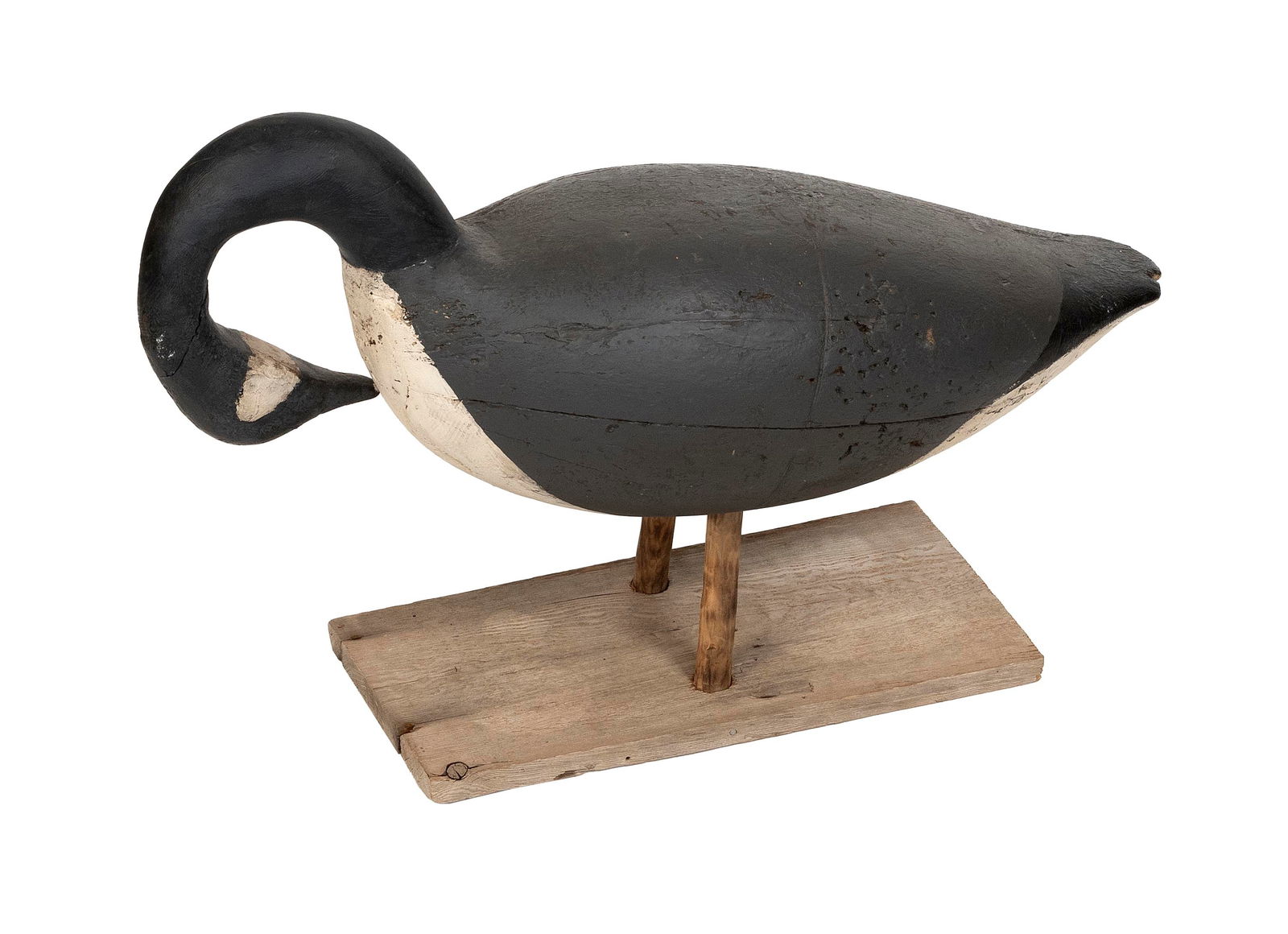 TWO PRINCE EDWARD ISLAND GOOSE FIELD DECOYS Canada, 20th Century Lengths approx. 31".: TWO PRINCE EDWARD ISLAND GOOSE FIELD DECOYSCanada, 20th CenturyOne in preening form, with old gunning repaint and "JSR" brand. Other mounted on a cedar post.Lengths approx. 31".