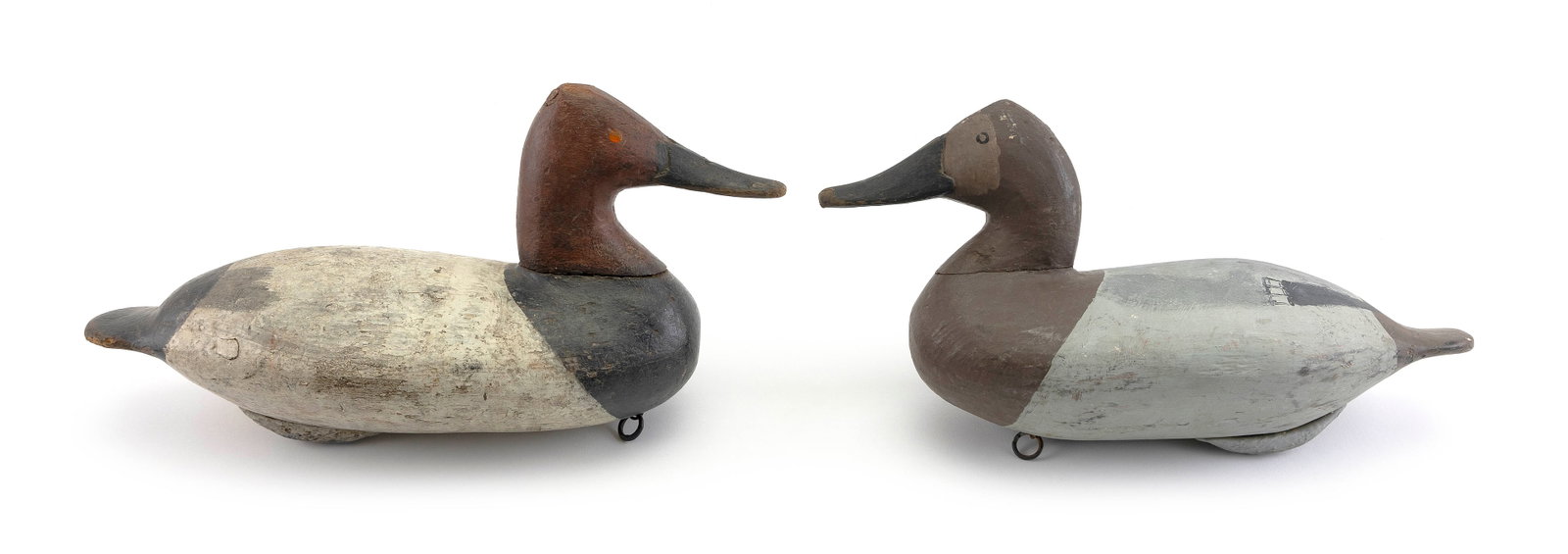 TWO CHESAPEAKE BAY AREA CANVASBACK DECOYS 20th Century Lengths 15.5" and 16".: TWO CHESAPEAKE BAY AREA CANVASBACK DECOYS 20th Century Makers unknown. Drake with "AB" carved into underside. Lengths 15.5" and 16".