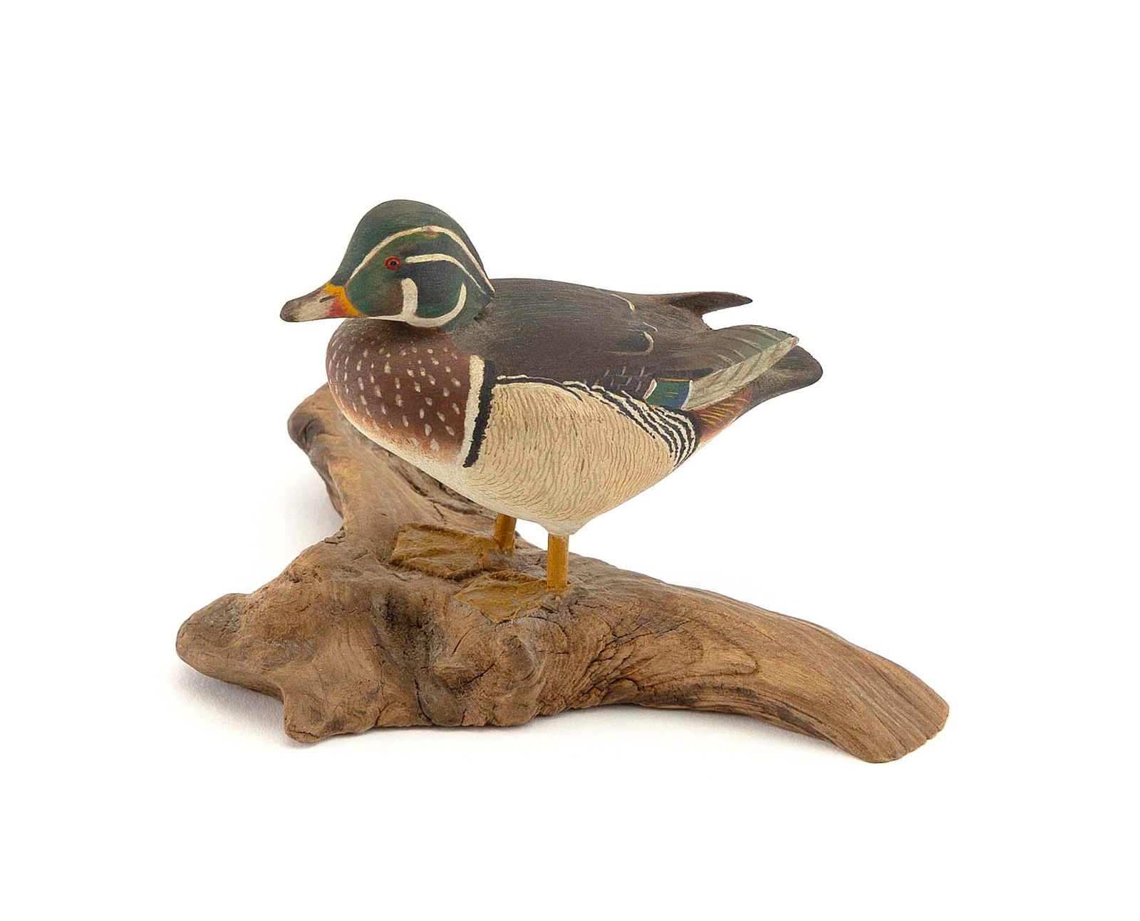 HAROLD NELSON GIBBS MINIATURE WOOD DUCK DRAKE CARVING Barrington, Rhode Island, 1886-1970 Height: HAROLD NELSON GIBBS MINIATURE WOOD DUCK DRAKE CARVINGBarrington, Rhode Island, 1886-1970Mounted on a driftwood base. Signed and dated in pencil "HG 1948".Height 2.75".