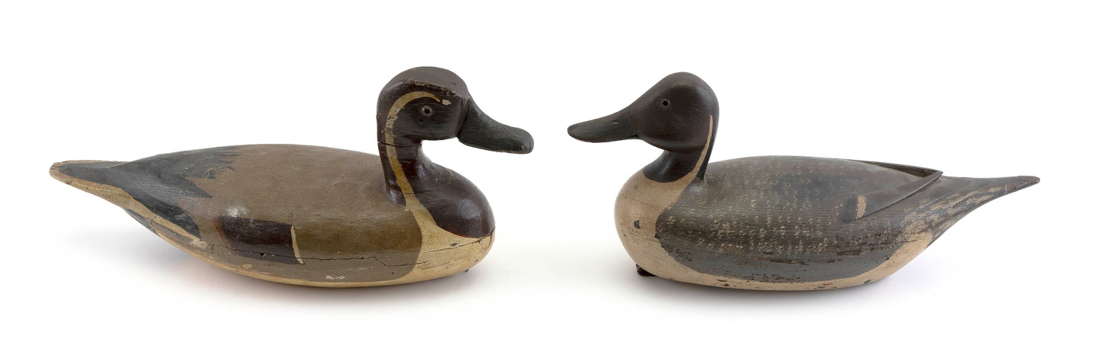 TWO ILLINOIS RIVER PINTAIL DECOYS 20th Century Lengths 16" and 17".: TWO ILLINOIS RIVER PINTAIL DECOYS 20th Century Both hollow-carved. Glass eyes. Lengths 16" and 17".