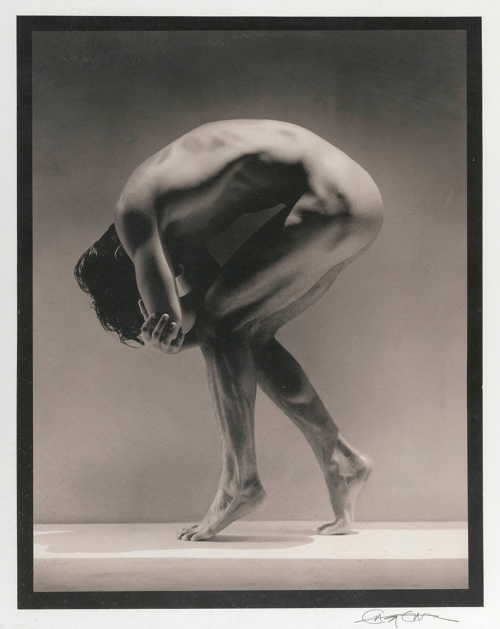 GREG GORMAN (Kansas/California, 1949-), "Tony Ward (Bent Over)", circa 1990., Gum platinum print,: GREG GORMANKansas/California, 1949-"Tony Ward (Bent Over)", circa 1990. Signed lower right "Greg Gorman". Numbered 13/18 verso.Gum platinum print, 23.75" x 18.5". Sheet 32" x 26". Framed 36" x 30".