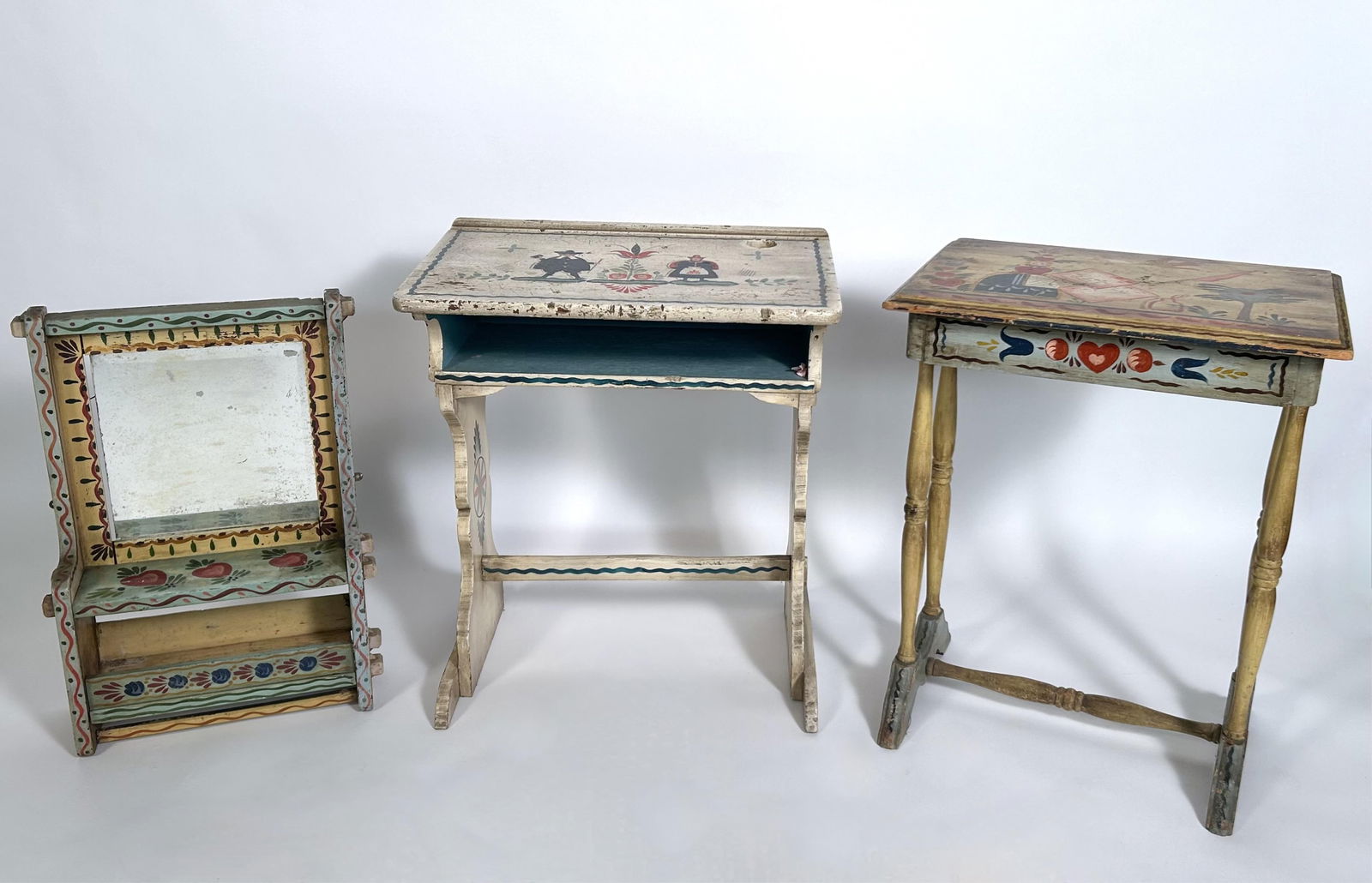 PETER HUNT (Massachusetts, 1896-1967), A school desk, a one-drawer stand and a large shaving mirror: PETER HUNTMassachusetts, 1896-1967A school desk, a one-drawer stand and a large shaving mirror with painted decoration. Heights from 25.5" to 28".