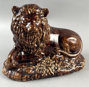 ROCKINGHAM-STYLE RECUMBENT LION FIGURE 19th Century Height 9.5". Width 11".