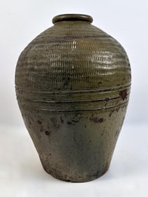 LARGE CHINESE MOTTLED GREEN GLAZE STONEWARE JAR 20th Century Height 19". Width 13".