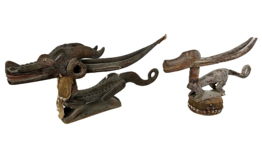 TWO AFRICAN CARVED WOODEN HEADDRESSES Late 19th/Early 20th Century Lengths 27" and 40".