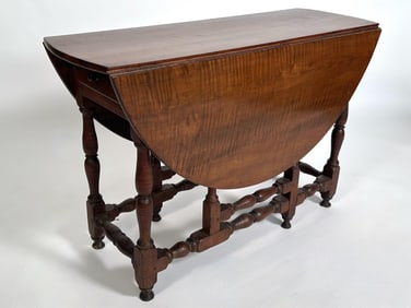TIGER MAPLE GATE-LEG TABLE 19th Century Height 28". Length 14" plus two 17" drop leaves. Width 40".