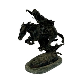 AFTER FREDERIC REMINGTON (20th Century,), "Cheyenne"., Bronze on a green marble base, height 20".