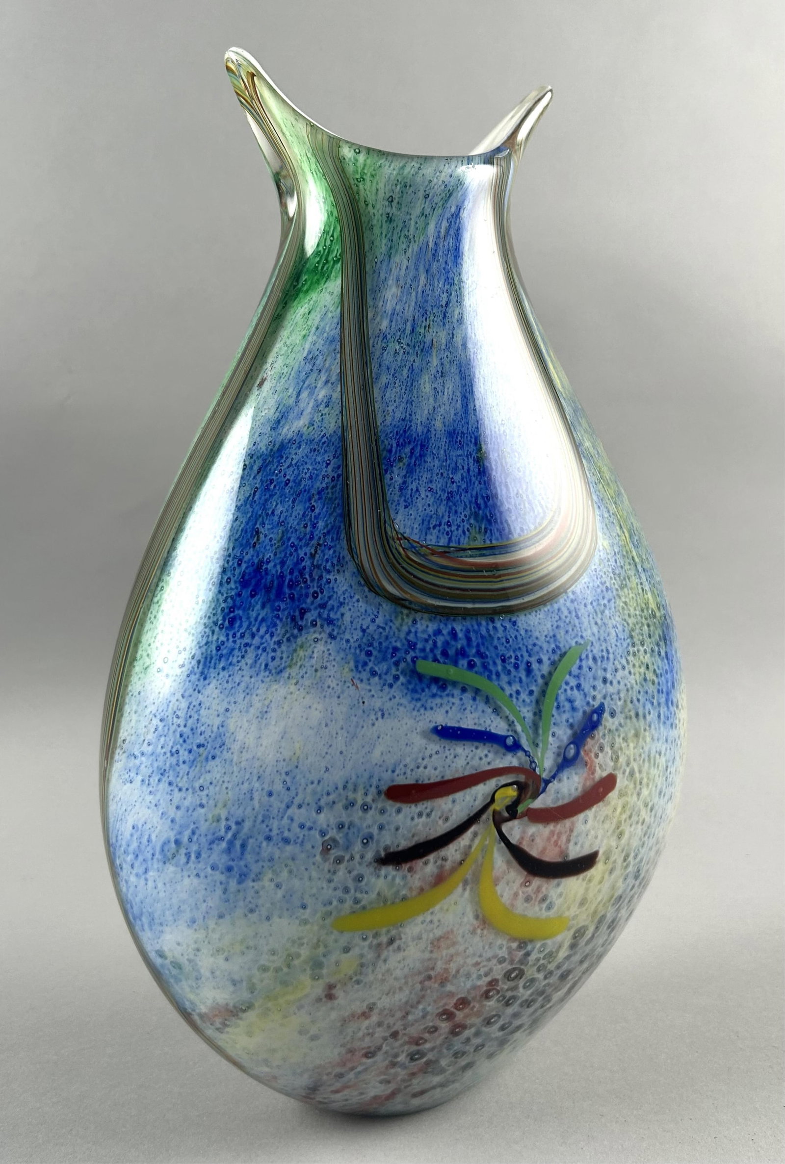 MURANO BLOWN GLASS FISH-SHAPED VASE 20th Century Height 13". Width 8".: MURANO BLOWN GLASS FISH-SHAPED VASE 20th Century Multicolored swirls and rods against a speckled ground. Height 13". Width 8".