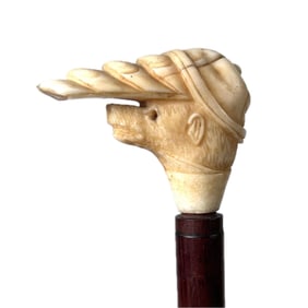 BEAR WEARING A BALL CAP CANE Late 19th/Early 20th Century Length 33.75".