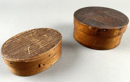 TWO SMALL WOODEN MEASURES 19th Century Round height 2.25". Diameter 4.675". Oval height 1.125". Top