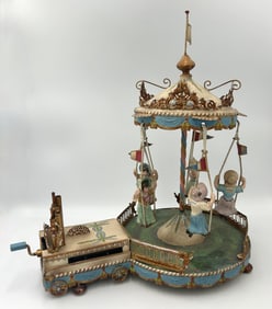 GERMAN MUSICAL TIN DOLL CAROUSEL 20th Century Height 15".