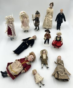 TWELVE GERMAN BISQUE DOLLS Most circa 1910 Heights from 3" to 8".