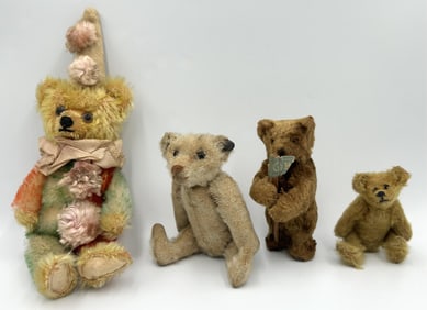 FOUR PLUSH BEARS Early 20th Century Heights from 3.5" to 9.5".