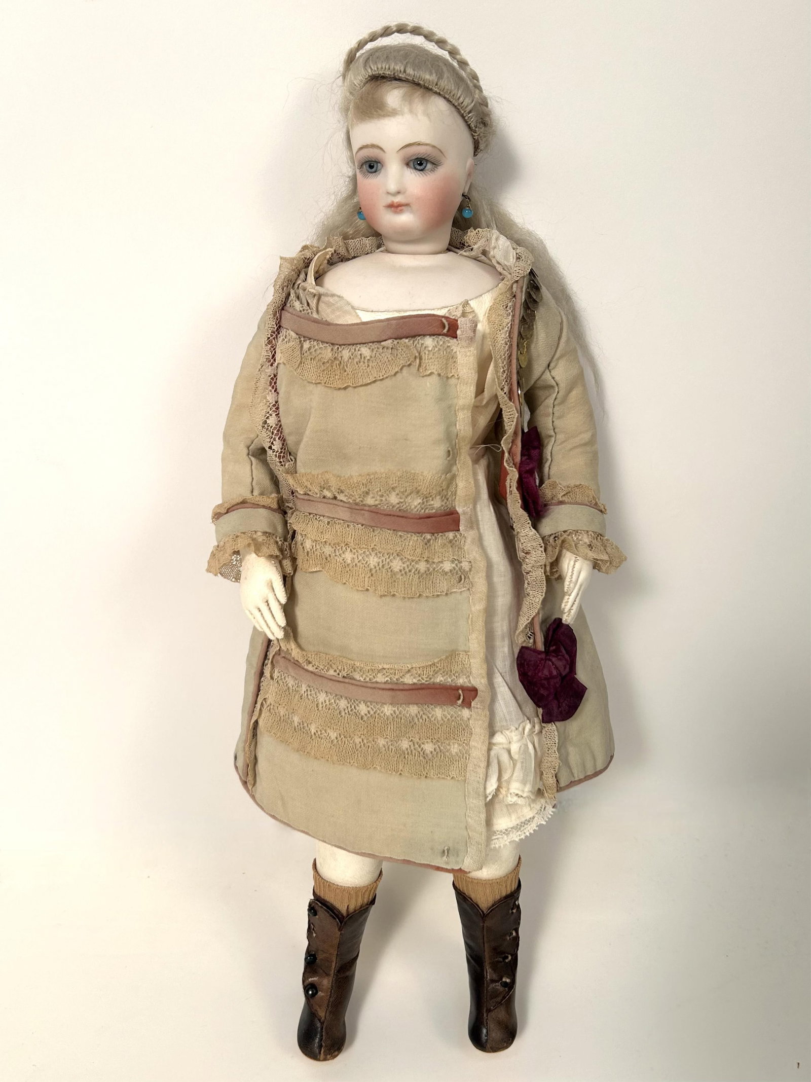 FRENCH FASHION DOLL Circa 1870 Height 16".: FRENCH FASHION DOLL Circa 1870 With blonde wig, blue eyes, pierced ears and kid body. Wearing an aqua dress with lace banding. Stamped "2" on back of neck. Height 16".