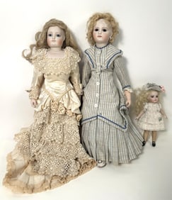 THREE REPRODUCTION FRENCH DOLLS Late 20th Century Heights from 7" to 16".