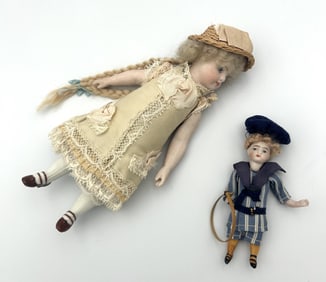 TWO GERMAN BISQUE DOLLS Circa 1900 Heights 4" and 7".