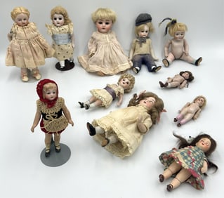 ELEVEN DOLLS, MOSTLY GERMAN BISQUE 20th Century Heights from 3" to 6".