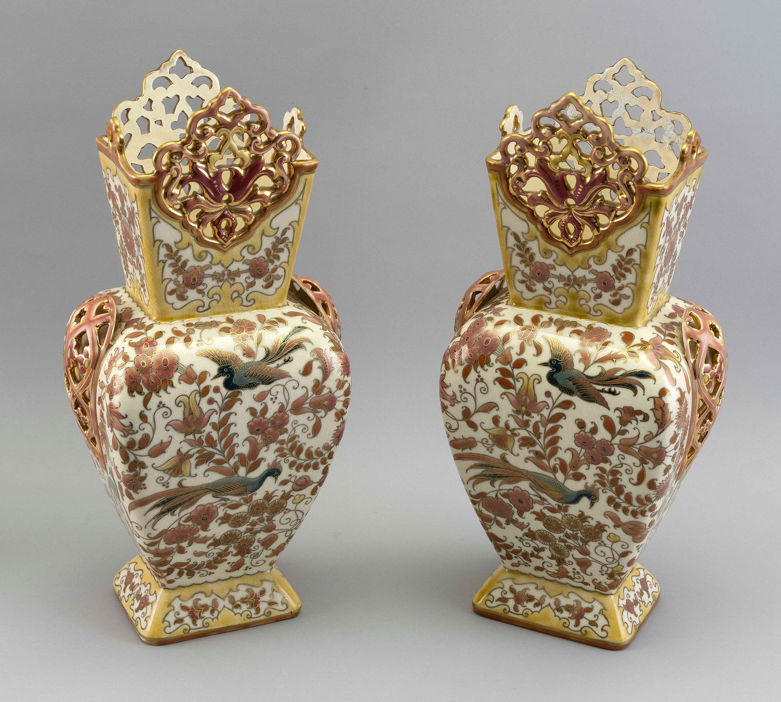 PAIR OF ZSOLNAY PECS PORCELAIN VASES Hungary, Late 19th Century Heights 15". Bases 3.75" x 4.5". (1 of 3)