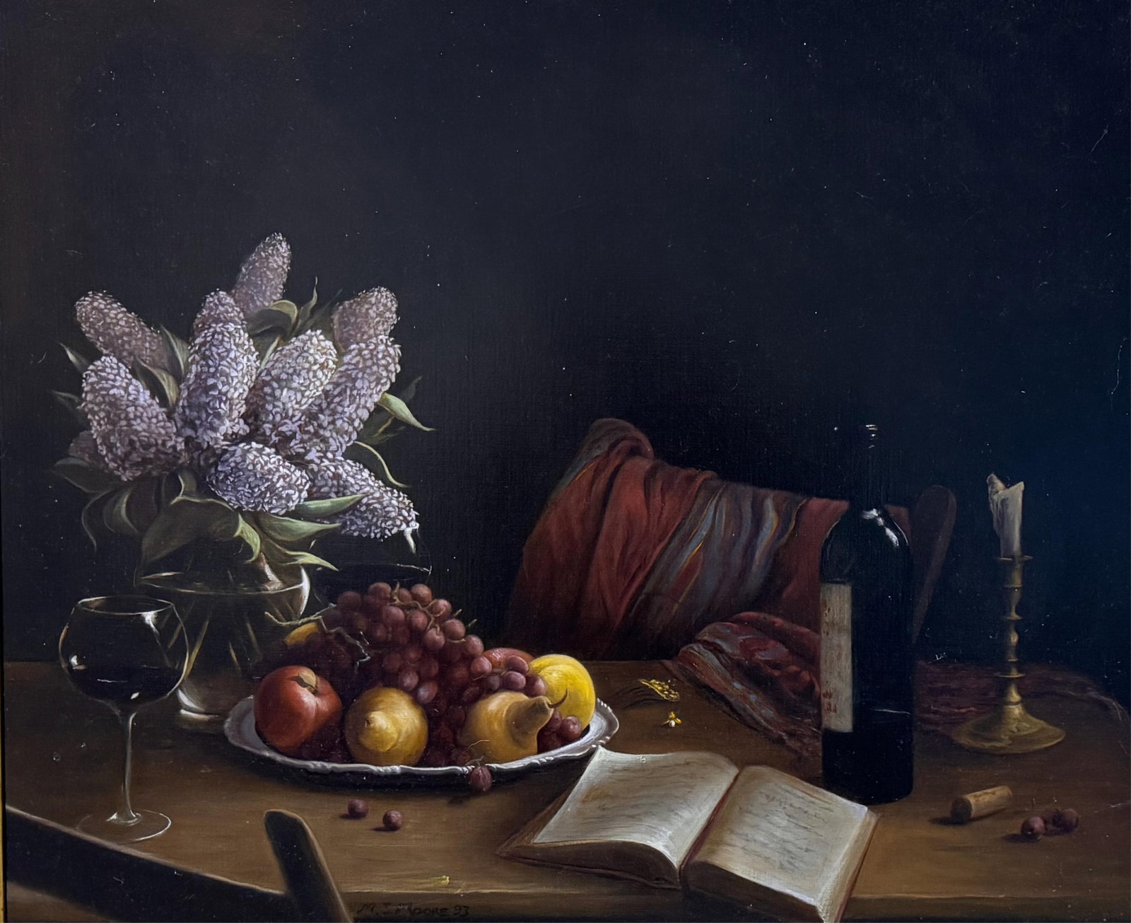 MICHAEL J. MOORE (Massachusetts, Contemporary), Still life of fruit, lilacs, an open book and a: MICHAEL J. MOORE Massachusetts, Contemporary Still life of fruit, lilacs, an open book and a bottle of wine. Signed and dated lower left "M.J. Moore 93". Oil on canvas, 30" x 36". Framed 34" x 40".