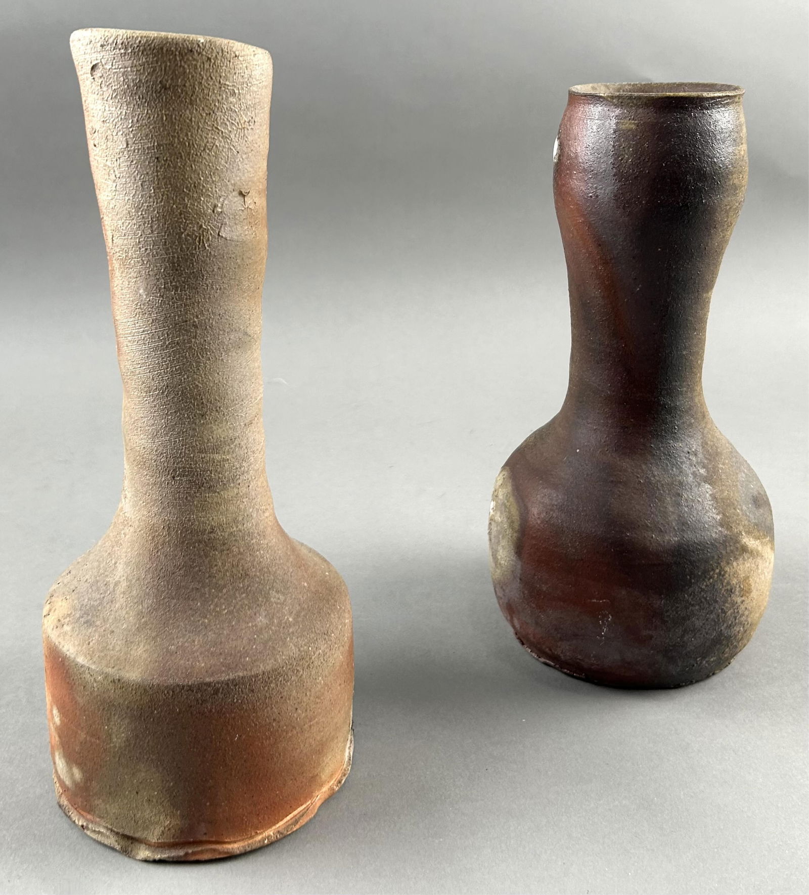PAUL CHALEFF (New York, 1947-), Two slender vessels., Stoneware, heights 9" and 10.25". (1 of 4)