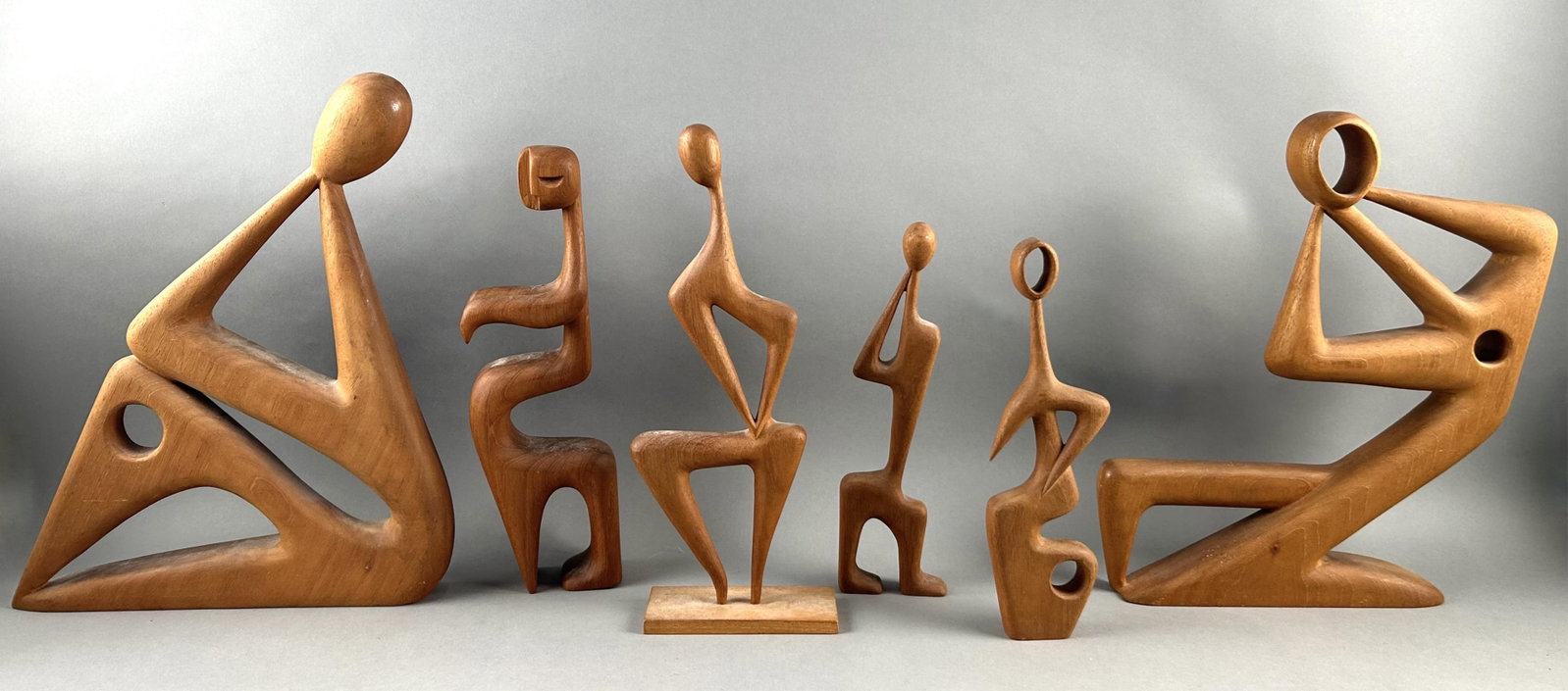 SIX TEAK FIGURAL SCULPTURES Mid-20th Century Heights from 11.5" to 16.5".: SIX TEAK FIGURAL SCULPTURES Mid-20th Century Various forms. Heights from 11.5" to 16.5".