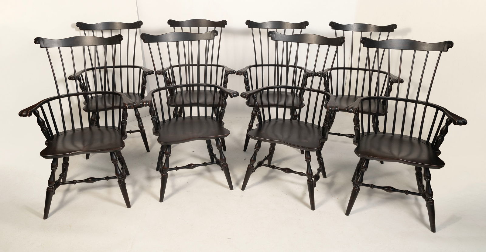 SET OF EIGHT COMB-BACK WINDSOR CHAIRS America, Contemporary Back heights 44". Seat heights 17.5".: SET OF EIGHT COMB-BACK WINDSOR CHAIRSAmerica, ContemporaryUnder a dark finish.Back heights 44". Seat heights 17.5".