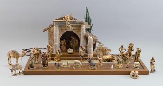 ANRI WOOD CARVINGS NATIVITY SET WITH ILLUMINATED CR?CHE Italy, 20th Century Cr?che height 12". Width
