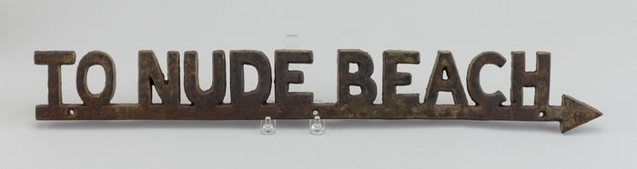 "TO NUDE BEACH" CAST IRON DIRECTIONAL SIGN 20th Century Height 2.75". Width 23".