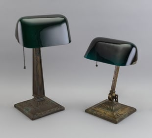 TWO STUDENT LAMPS WITH GREEN EMERALITE SHADES Early 20th Century Heights 18". Widths 13.5".