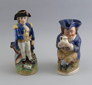 TWO STAFFORDSHIRE FIGURAL PITCHERS England, 19th Century Heights 9.25" and 11.5".