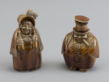 TWO ROCKINGHAM GLAZE FIGURAL BOTTLES England, 19th Century Heights 4.5" and 5.25".