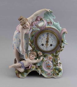 GERMAN PORCELAIN FIGURAL CLOCK 19th Century Height 12". Width 9.5". Depth 5".