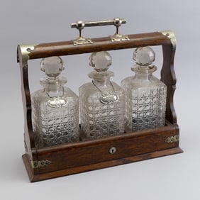 QUARTERED OAK LIQUOR CABINET WITH SILVER PLATED MOUNTS Late 19th/Early 20th Century Height 14.25".