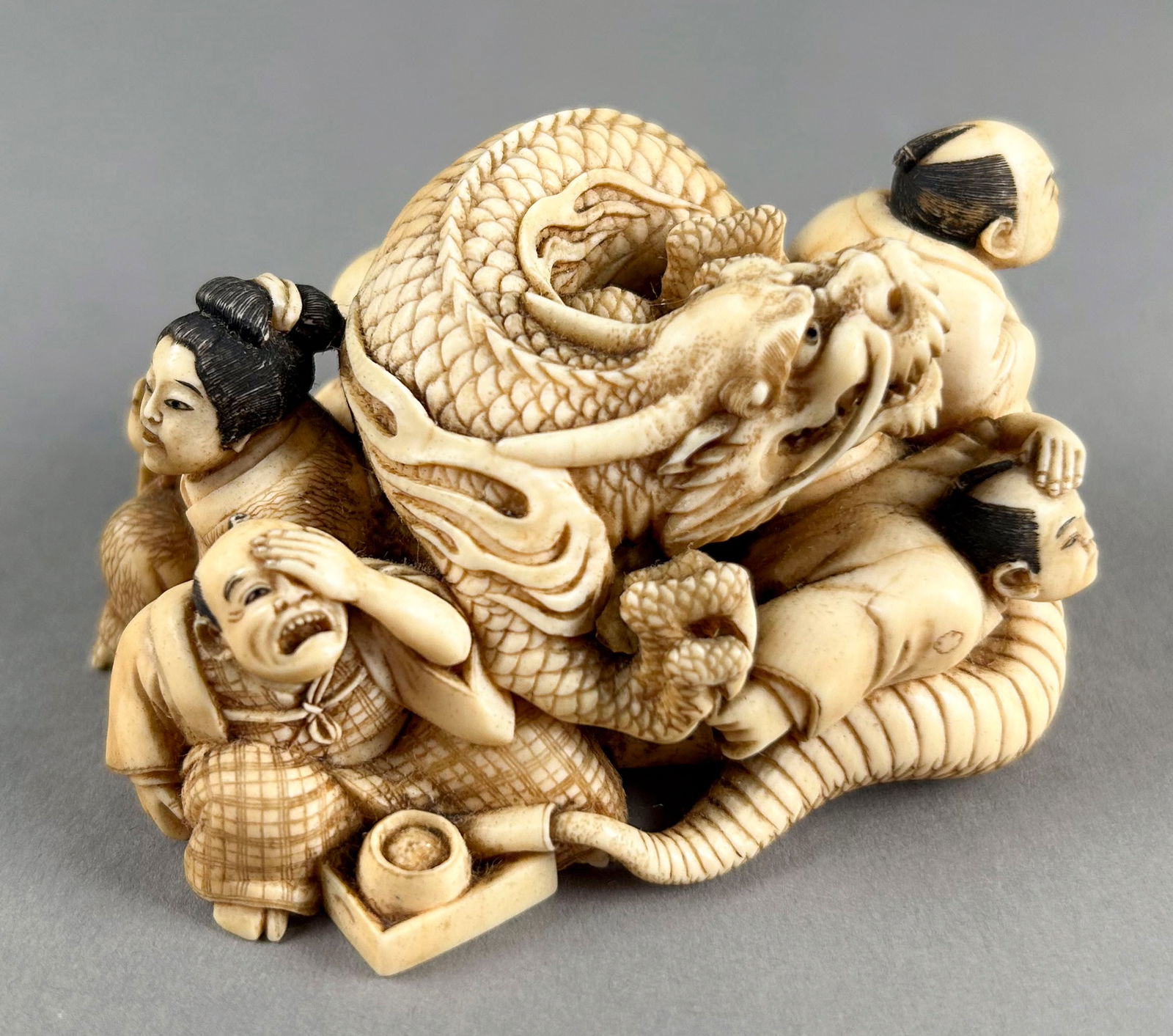 JAPANESE CARVED IVORY OKIMONO BY SHURAKU Late 19th Century Height 1.5". Length 3.25". (1 of 7)