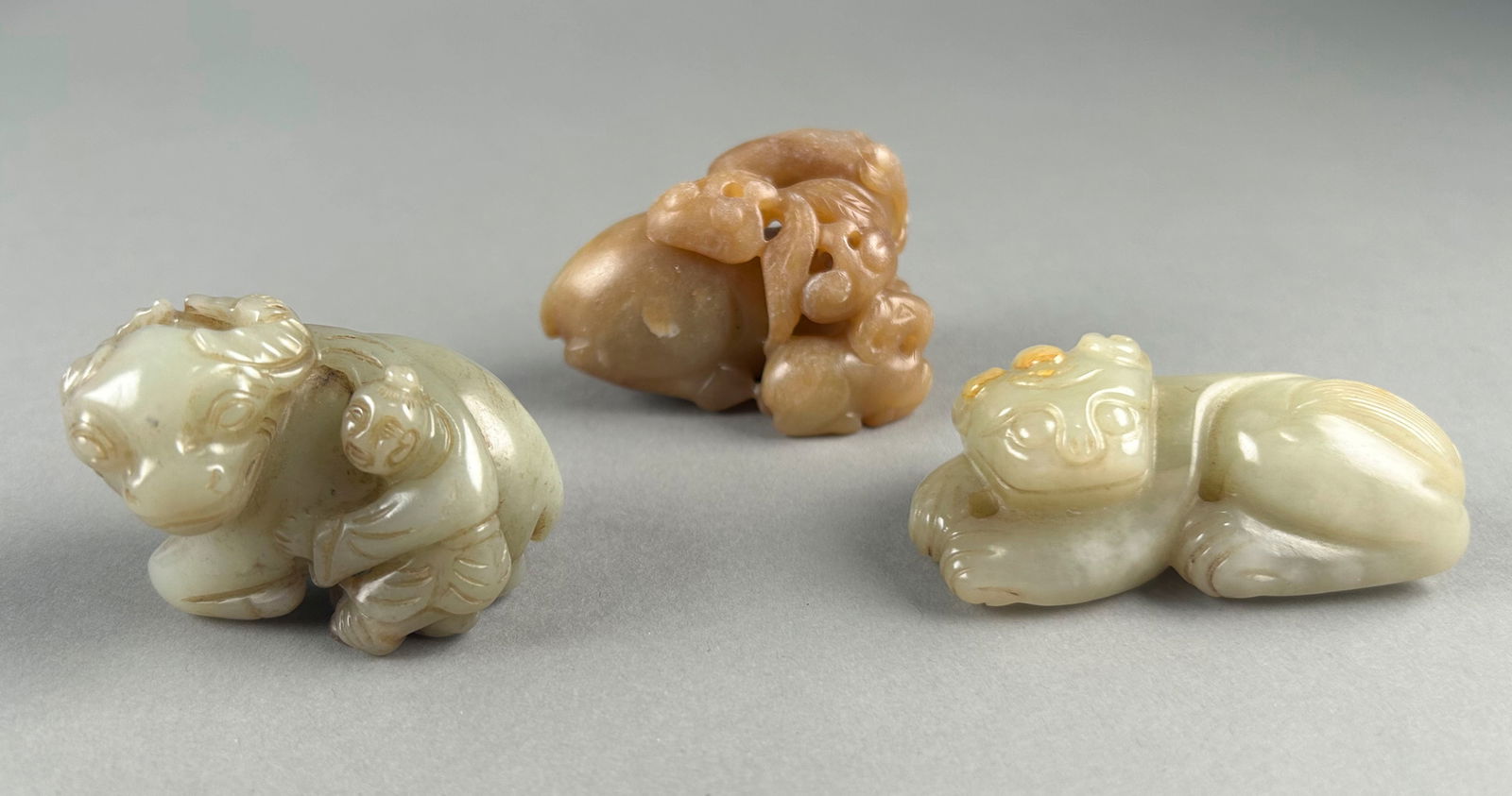 THREE ASSORTED CHINESE CARVED JADE FIGURE GROUPS Lengths from 2" to 3". (1 of 9)