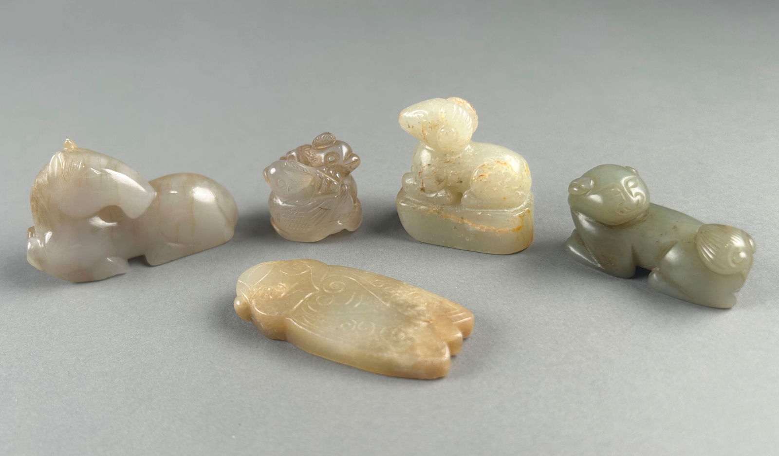 FOUR CHINESE SMALL JADE CARVED ANIMAL GROUPS Lengths from 1" to 2.25". (1 of 4)