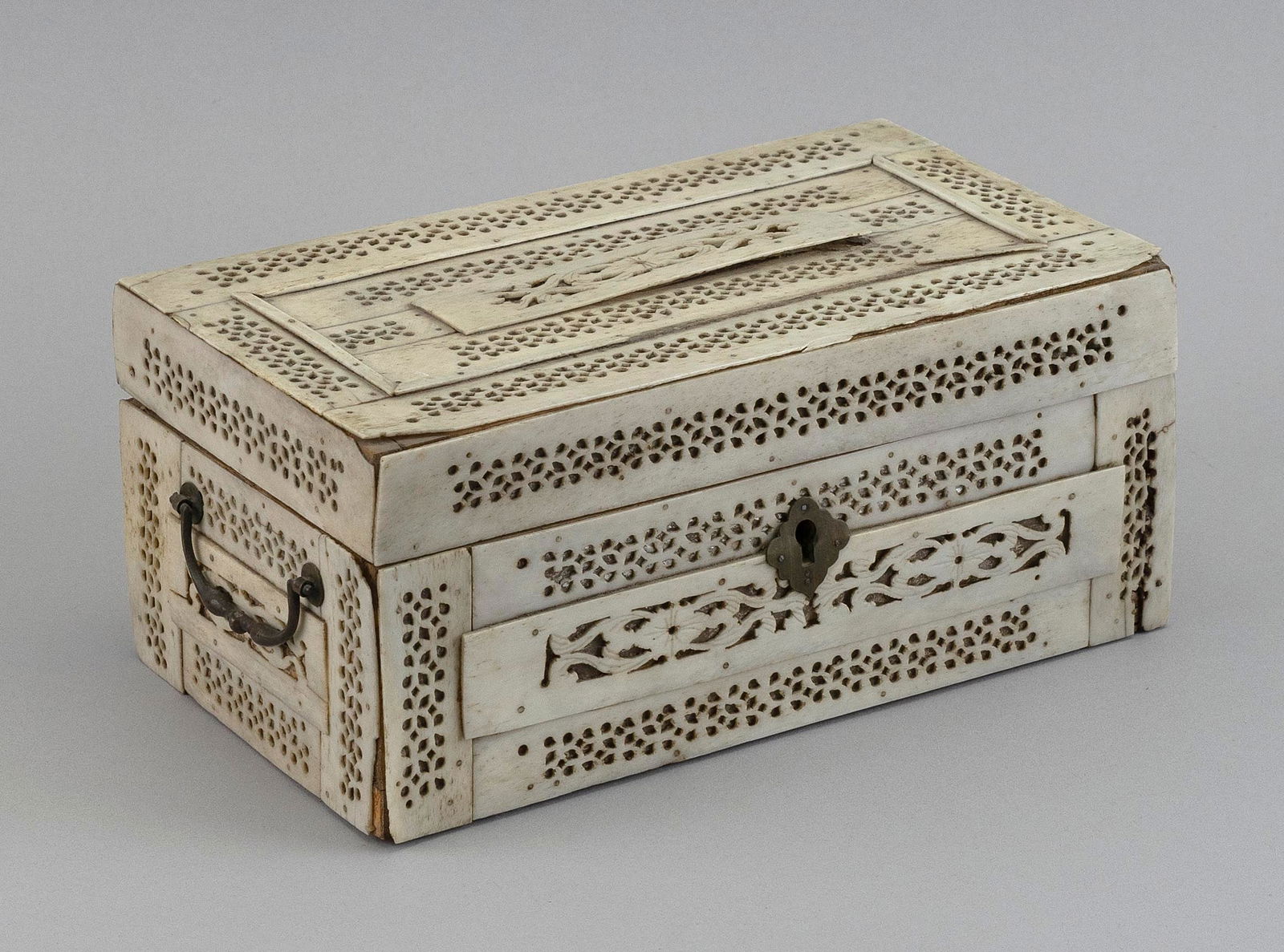 NAPOLEONIC PRISONER-OF-WAR BONE BOX England/France, Late 18th/Early 19th Century Height 3.75". Width: NAPOLEONIC PRISONER-OF-WAR BONE BOXEngland/France, Late 18th/Early 19th CenturyPierced carved bone panels in floral and foliate designs. Hinged lid with locking mechanism; key still present. Metal esc