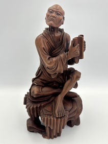 JAPANESE CARVED WOOD FIGURE OF A SCHOLAR 19th Century Height 9.5".
