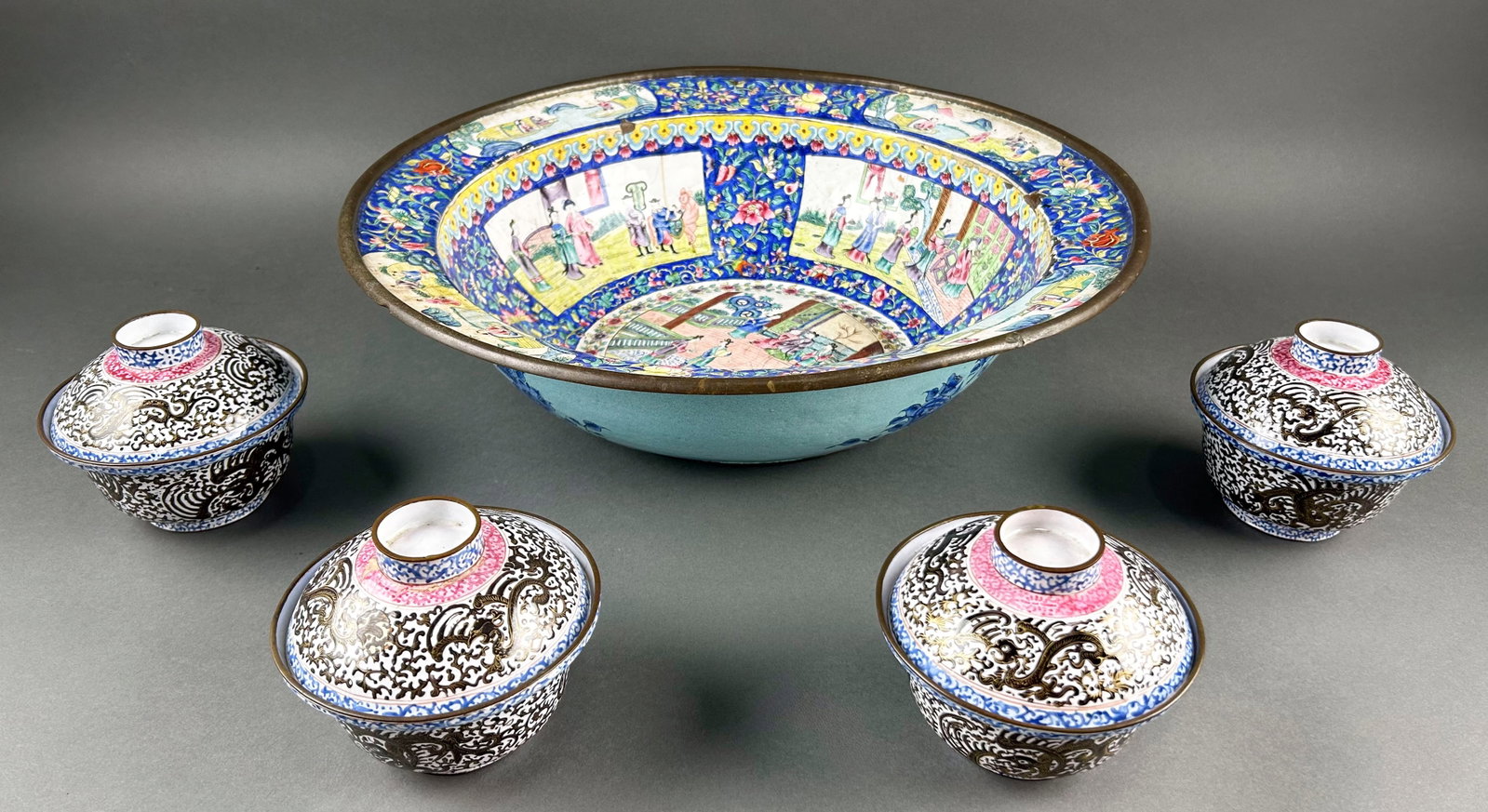 FIVE CHINESE FAMILLE ROSE ENAMEL TABLEWARES 19th/20th Century: FIVE CHINESE FAMILLE ROSE ENAMEL TABLEWARES 19th/20th Century 1) Basin with figural landscape decoration. Height 5". Diameter 17". 2-5) Four covered bowls with phoenix decoration on the exteriors and 