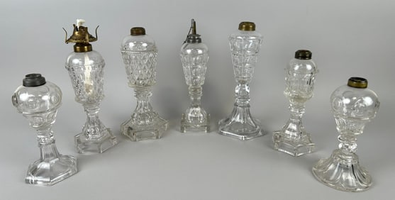 SEVEN FLINT PATTERN GLASS LAMPS 19th Century Heights from 8.5" to 11".
