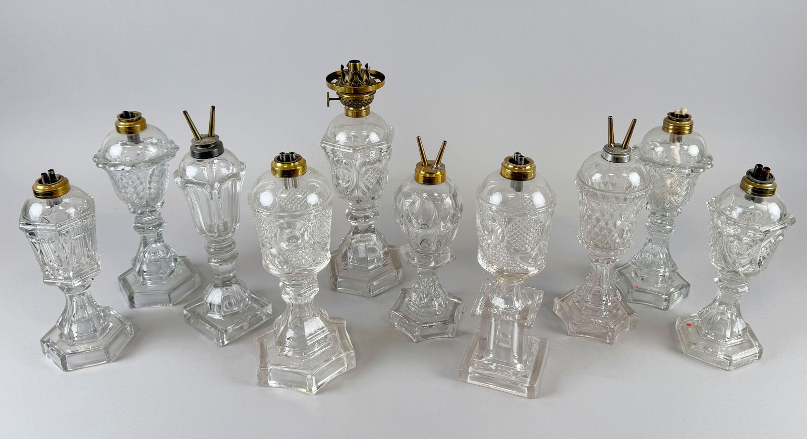 TEN FLINT PATTERN GLASS LAMPS Mid-19th Century Heights from 9.5" to 11.5". (1 of 1)