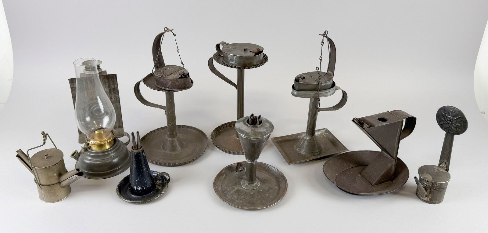 NINE TIN LAMPS AND LANTERNS Late 18th/19th Century Heights from 6" to 12". (1 of 1)