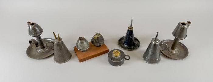 EIGHT TIN LAMPS First Half of the 19th Century Heights from 2.25" to 6.25".